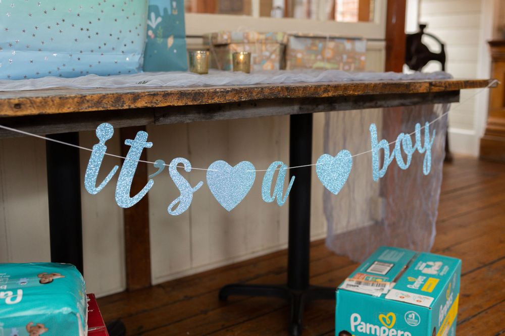 Blue heart banner decoration with turquoise boxes displayed on a counter.