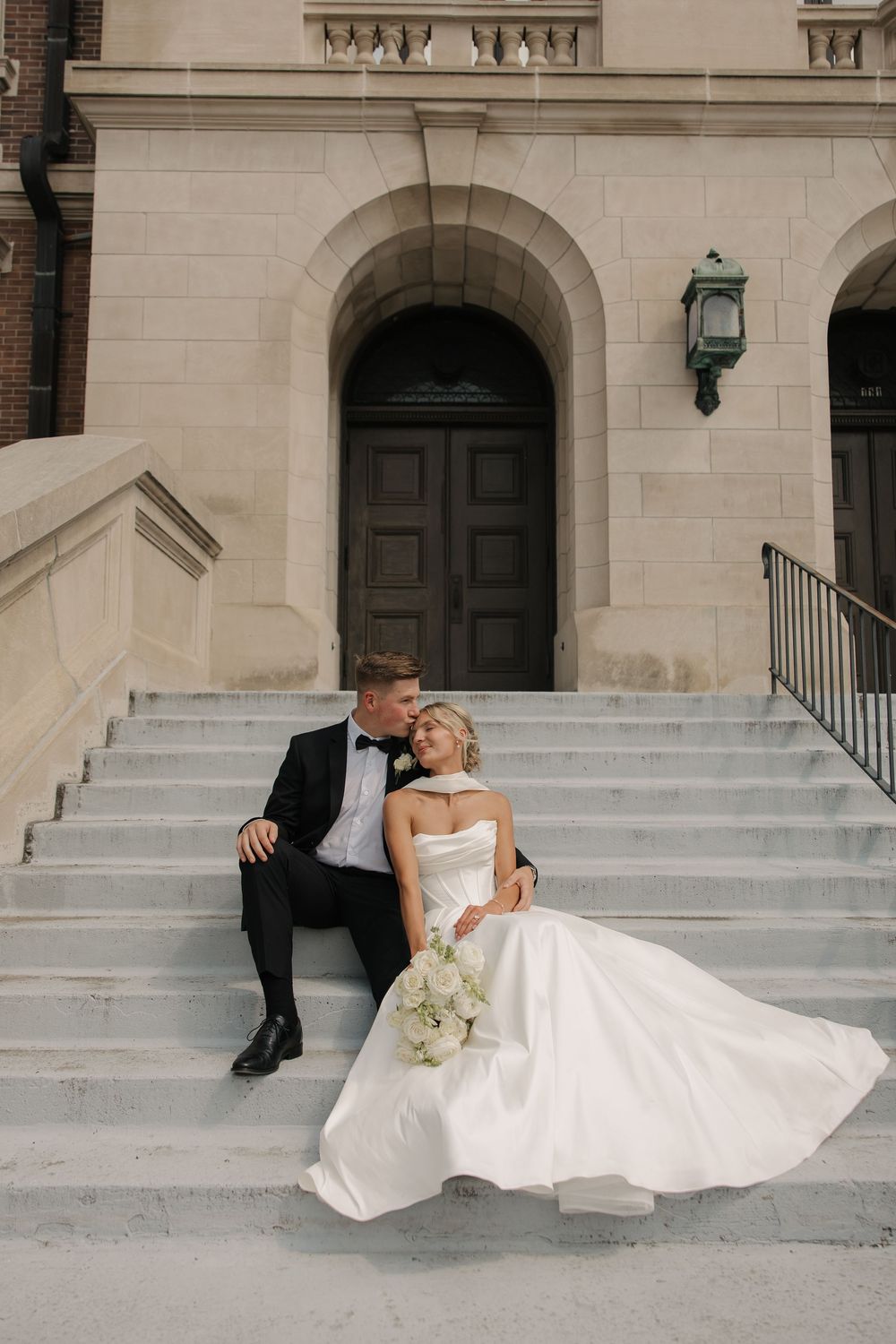 A series of artistic wedding photos showing a couple sitting on elegant stone steps in formal attire.