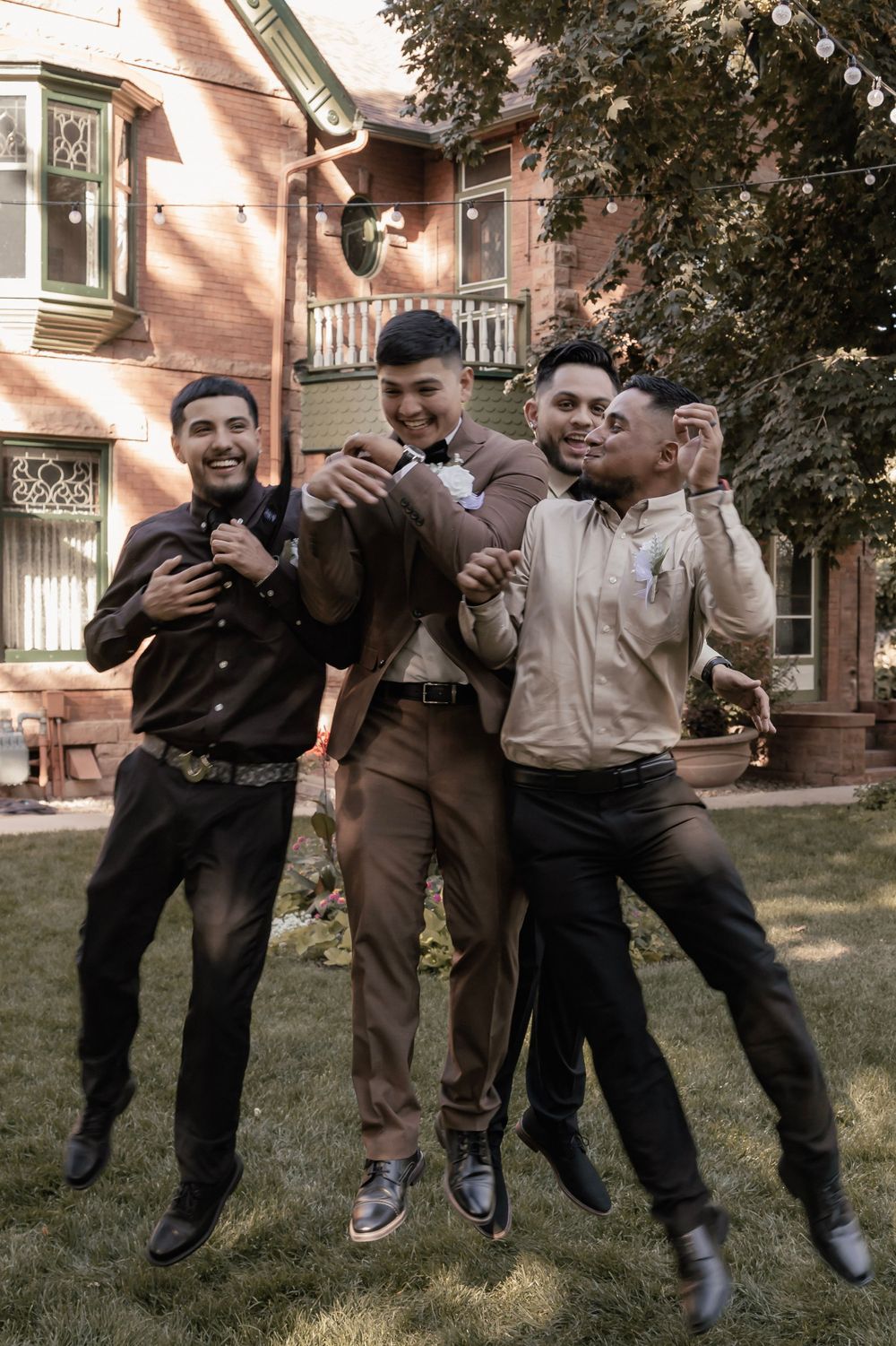 Groom and Groomsmen jumping and laughing
