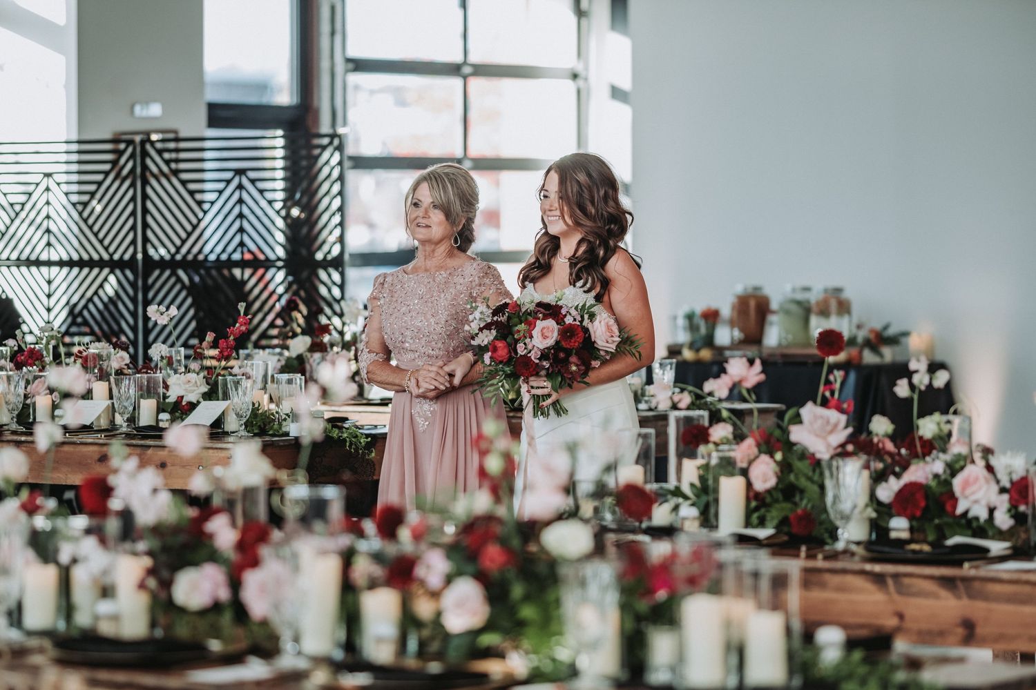 Elegantly decorated wedding reception tables with pink and white floral centerpieces.