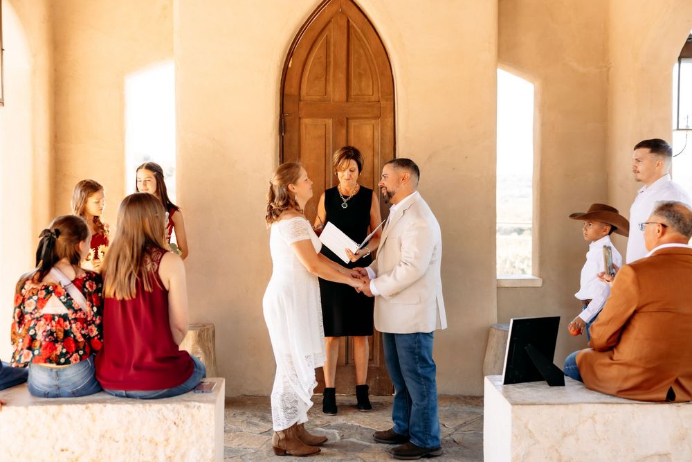 Series of romantic engagement photos captured in a historic building with wooden doors and natural lighting.