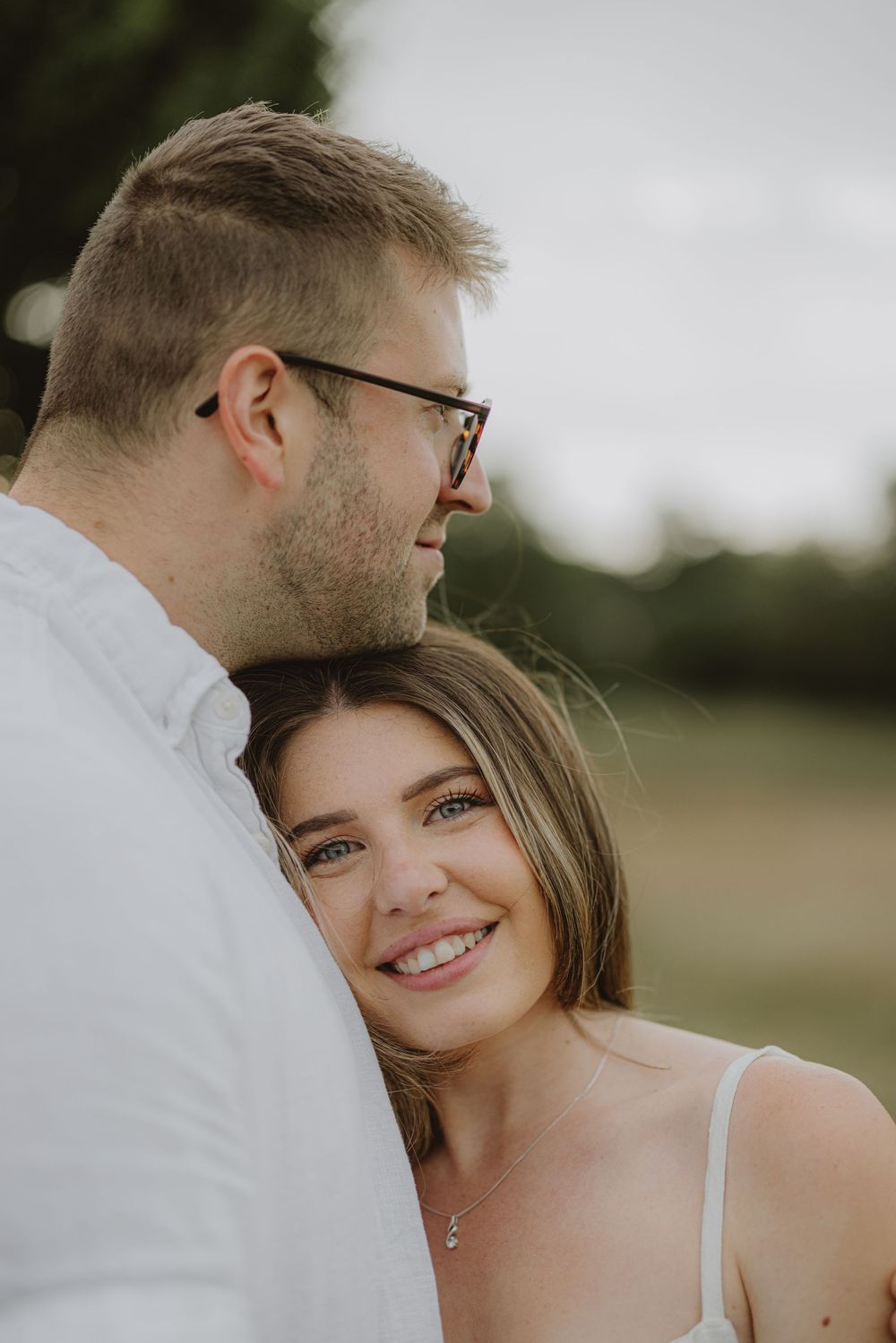 A romantic couple shares intimate moments while surrounded by summer wildflowers.