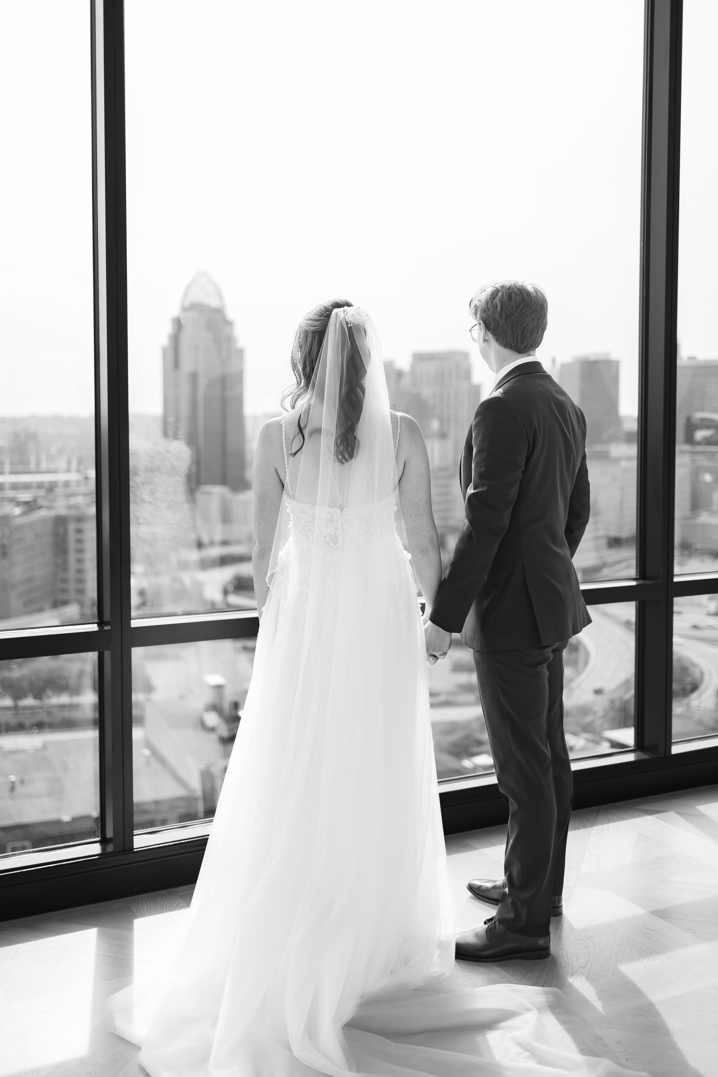 Bride and groom posing elegantly in front of the Cathedral Basilica of St. Peter in Chains, Cincinnati