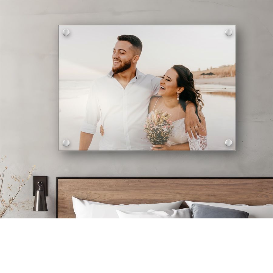 Wedding photo displayed as canvas art print above a modern bedroom headboard.