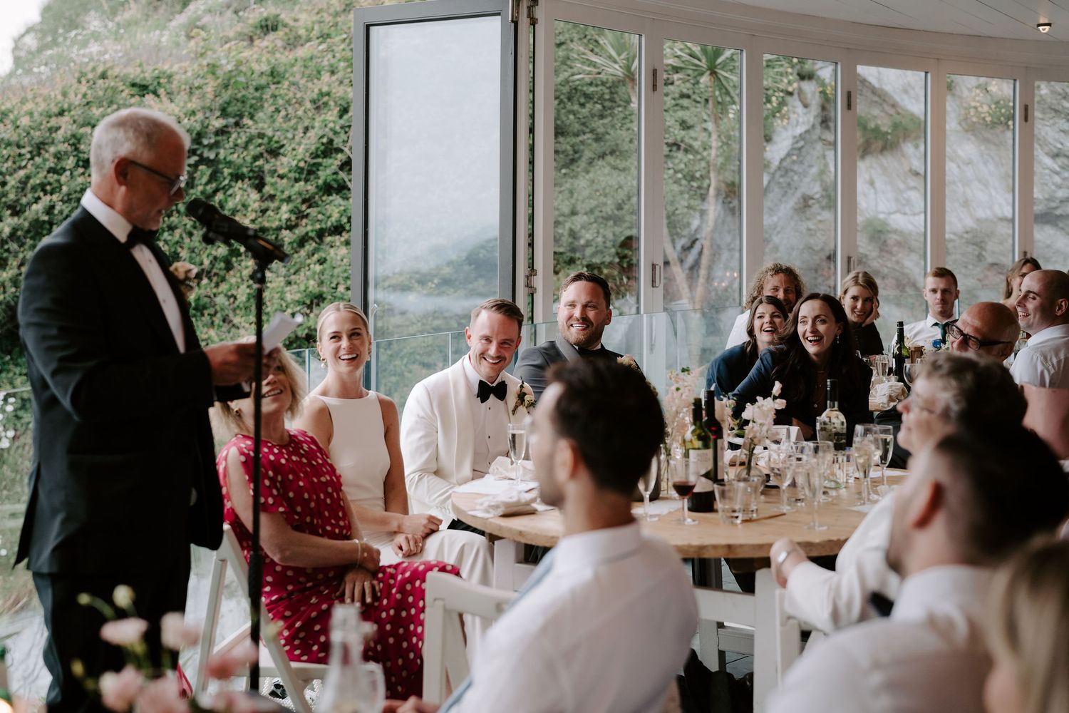 Brides father giving speech at Tunnels Beach wedding venue in north devon