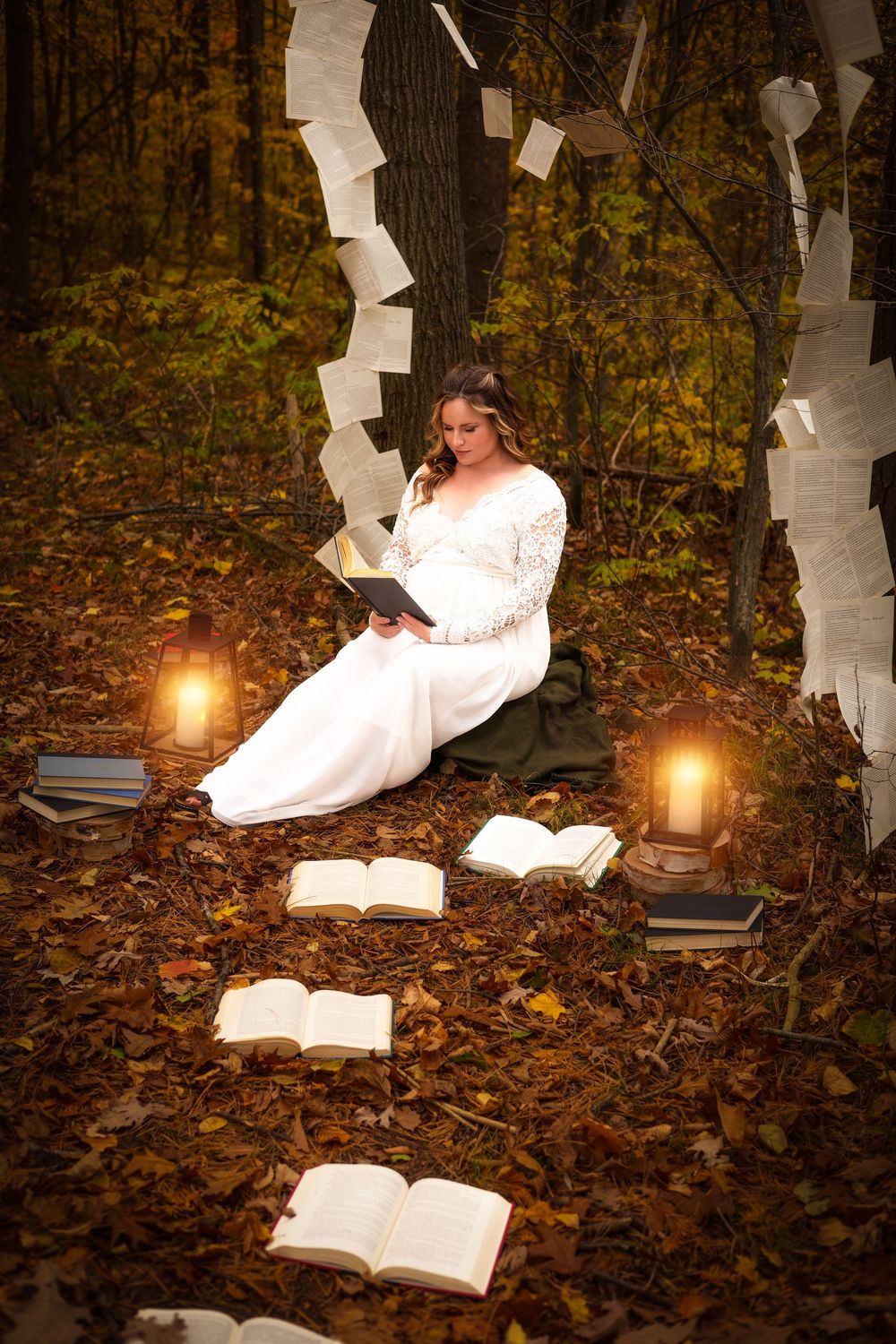Whimsical forest scene with open books, lanterns, and flowing white dress among autumn leaves.