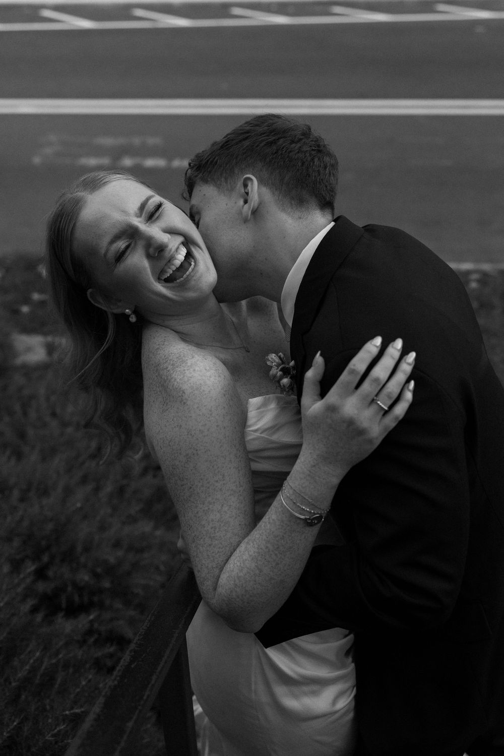 Black and white candid moment of bride and groom at Summerour Studio in Atlanta, Georgia