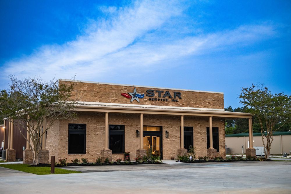 Commercial building exterior with blue sky and Star signage visible on brown facade.