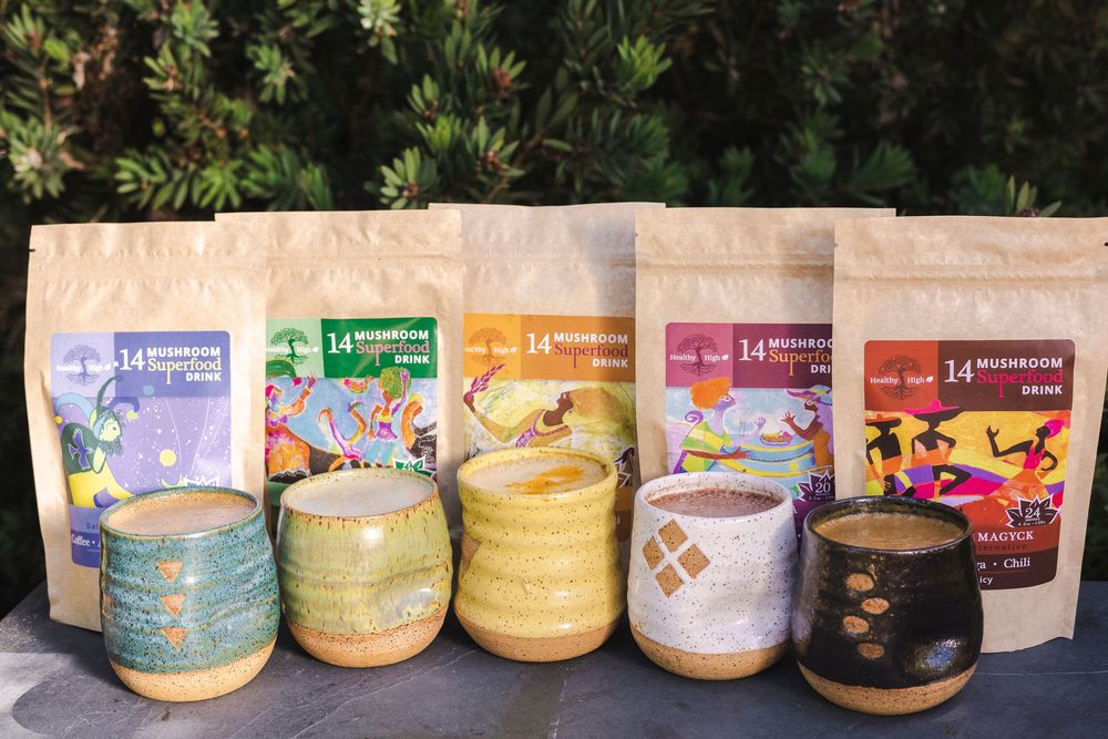 Collection of colorful ceramic bowls and branded tea packages arranged in a product display lineup.