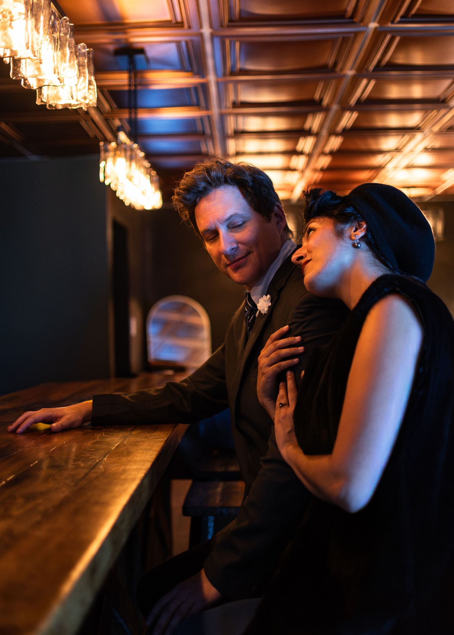 Couple sitting together at Highland Lounge in Belton Texas during lifestyle session