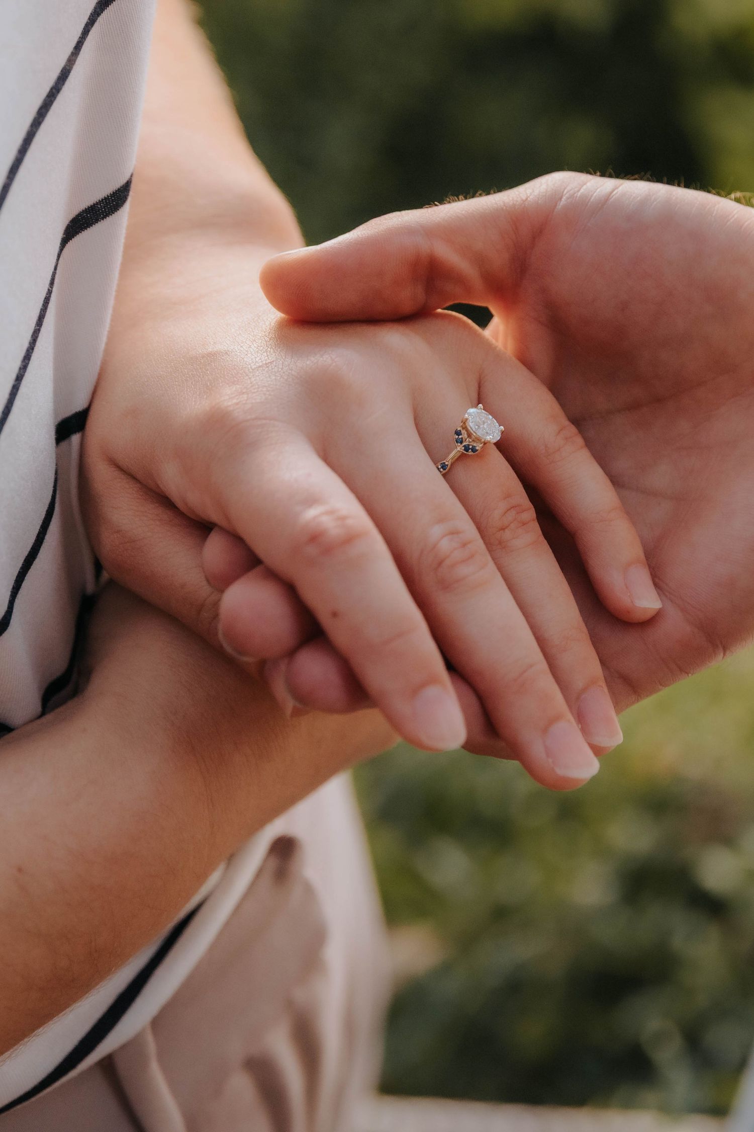 Intimate moment of couple whispering to each other after engagement.