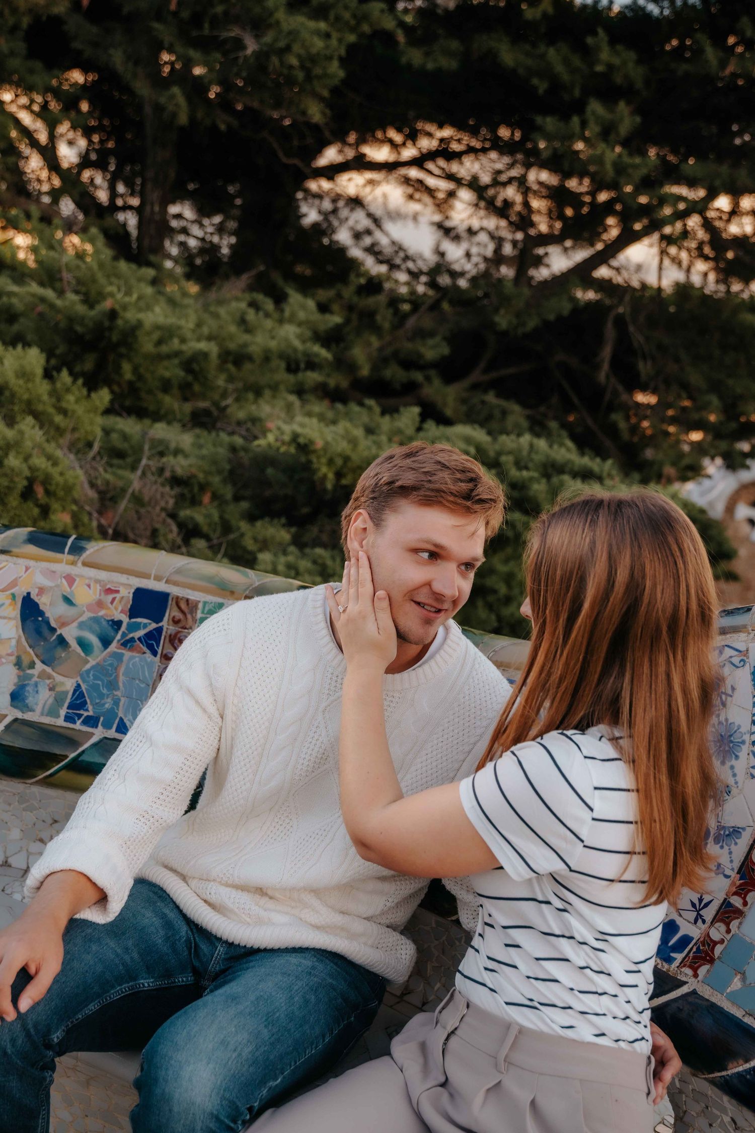 Sweet and tender hug between newly engaged couple in September afternoon.