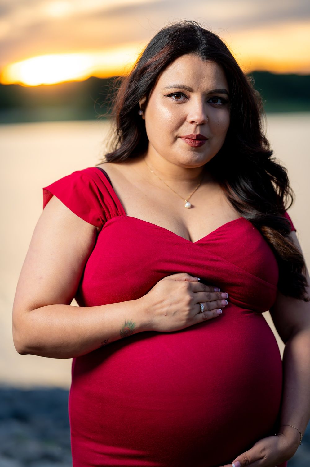 A series of sunset portraits showing a woman in a red dress against a waterfront backdrop.