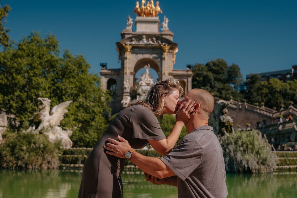 Romantic kiss between newly engaged couple in August afternoon.