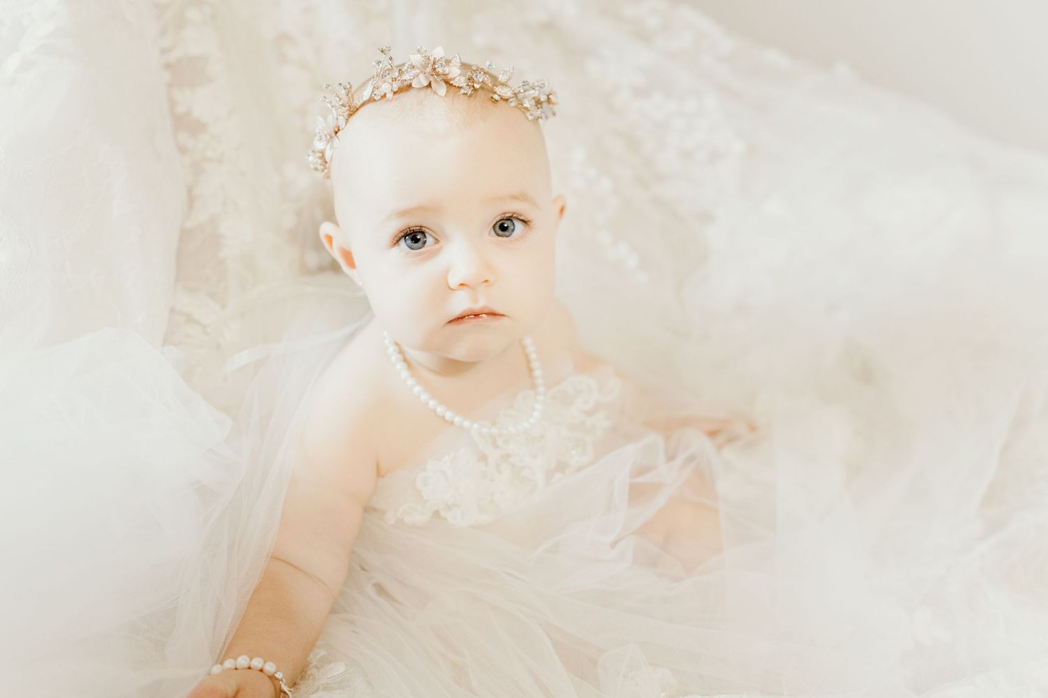Ethereal portrait with soft white lighting and dreamy atmosphere.