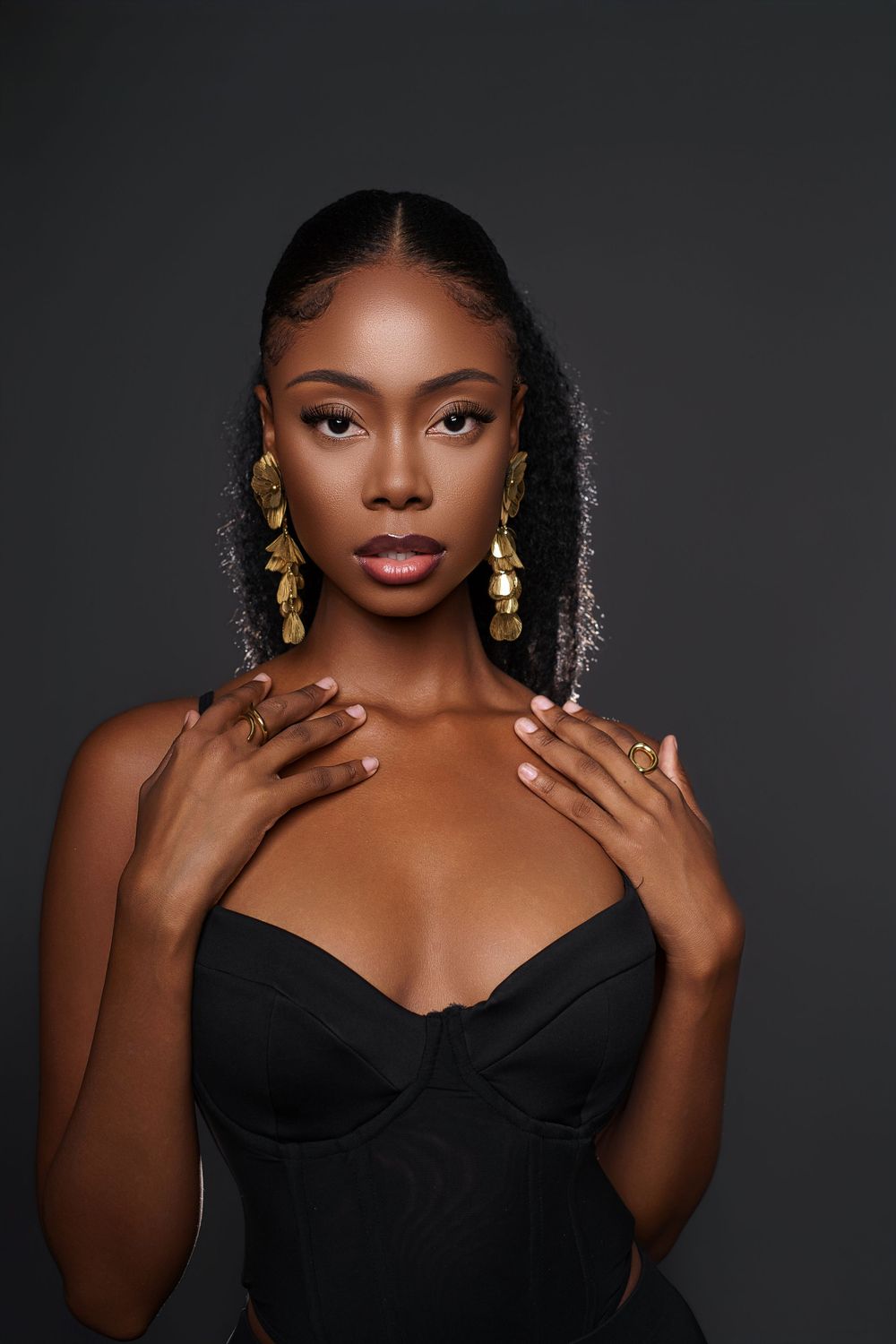 A glamorous fashion portrait series against a dark background featuring elegant gold jewelry and a black dress.
