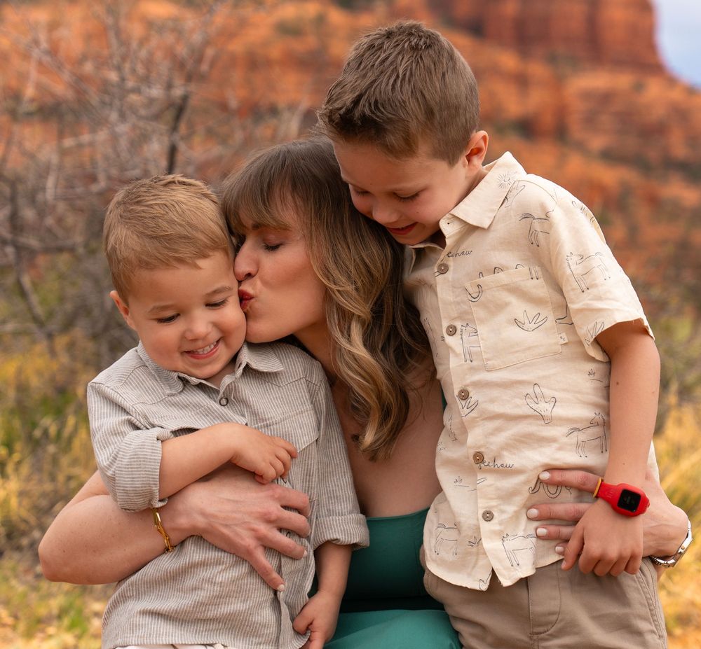 Tender family moments captured against stunning red rock formations in Sedona.