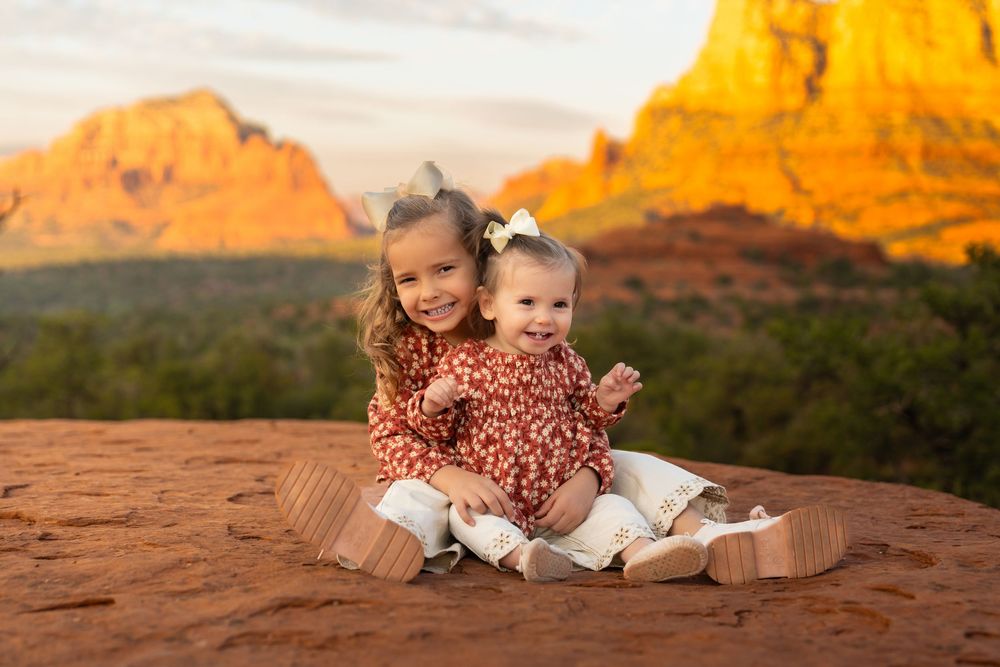 Red rock formations provide a stunning backdrop for a sunset photoshoot.