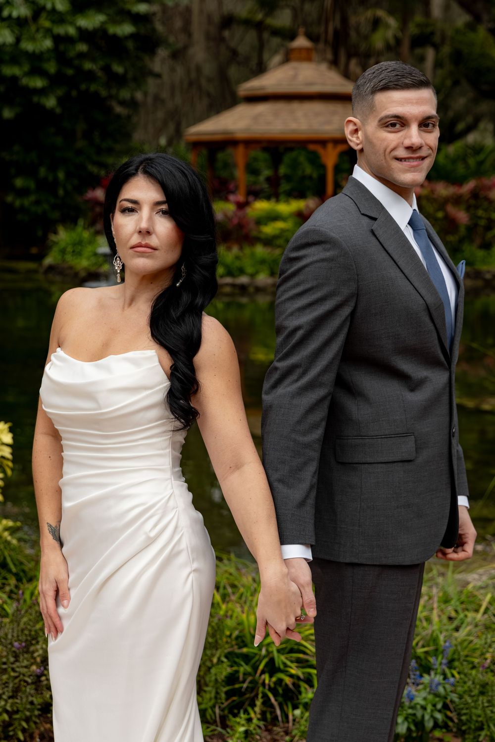 A series of romantic wedding photos showing a couple posing back-to-back in a garden setting.