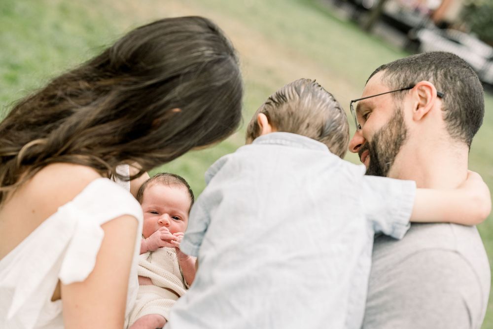 A collection of intimate outdoor portraits capturing tender embraces and sweet moments in a natural setting.