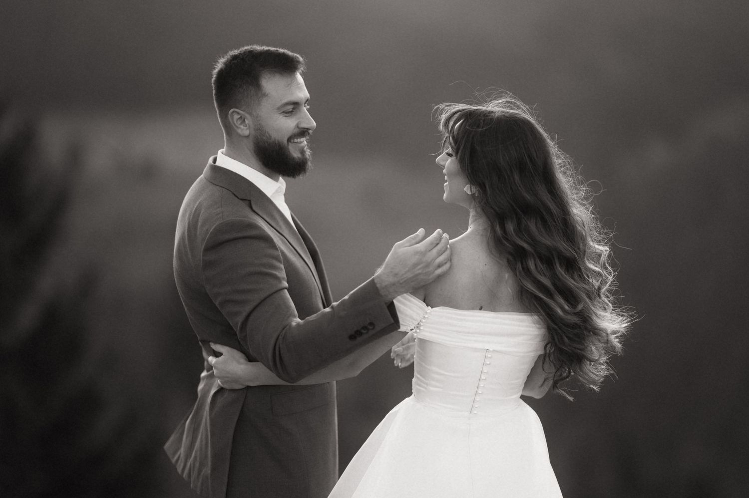 A romantic black and white wedding photo sequence showing a couple dancing together in formal attire.