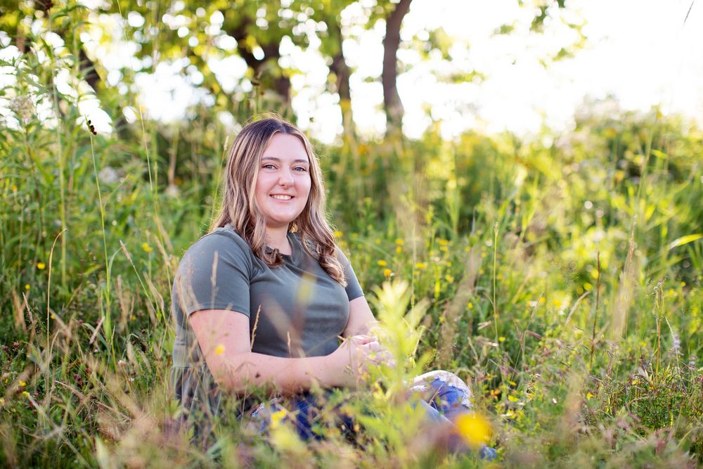 A series of outdoor portrait photos showing someone sitting in tall grass during golden hour sunset lighting.