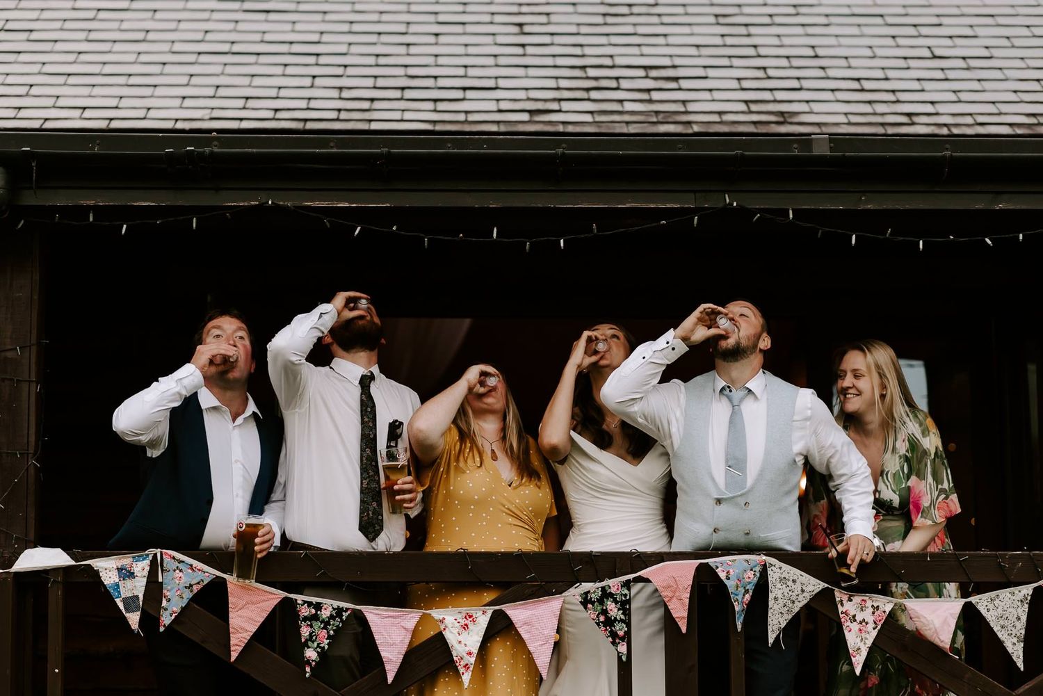 A collection of wedding reception photos showing festive decorations, dancing guests and celebratory moments at an indoor venue.