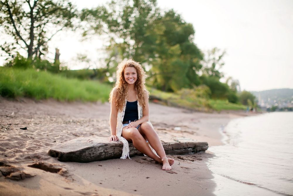 High school senior portrait with Lake Superior at Park Point Beach