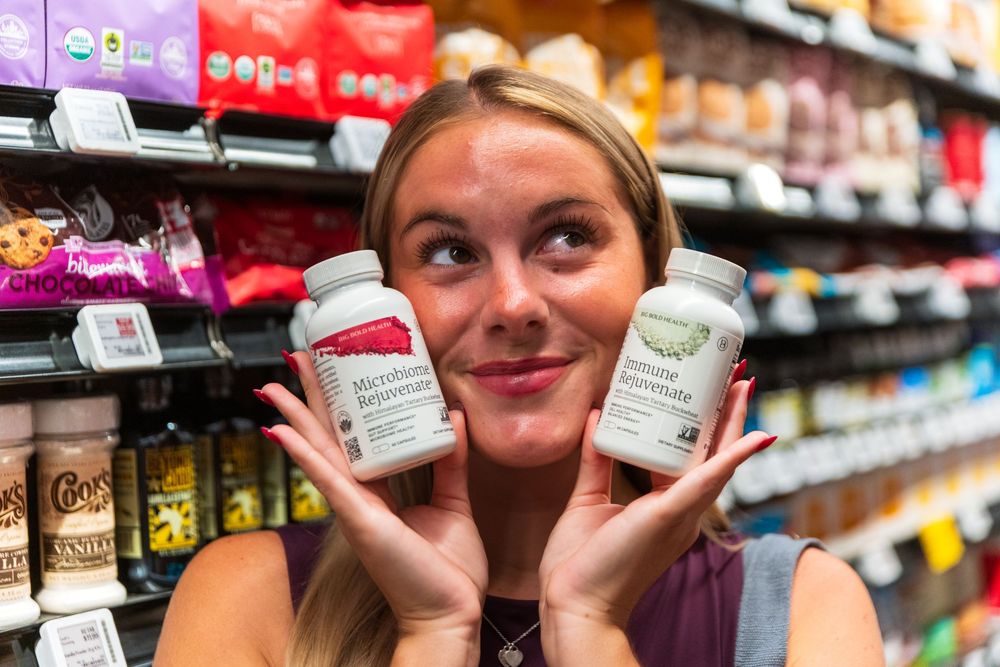 Supplement bottles being displayed in a retail store setting.