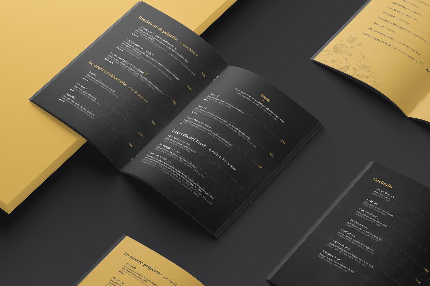 Mockup di menu aperto con pagine nere e dorate che mostrano un elegante design tipografico e di layout.