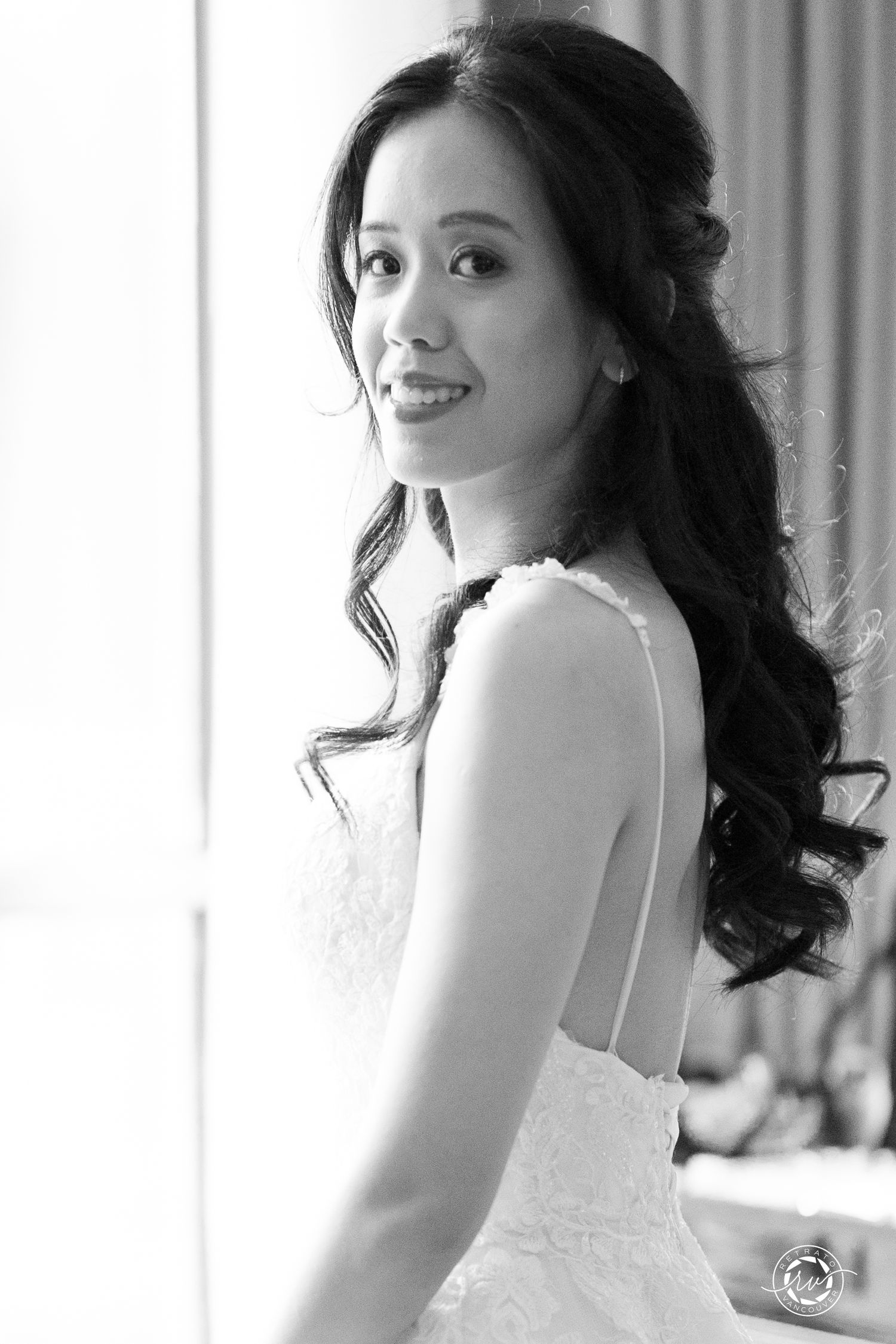 Black and white portrait series showing a woman in an elegant white dress.