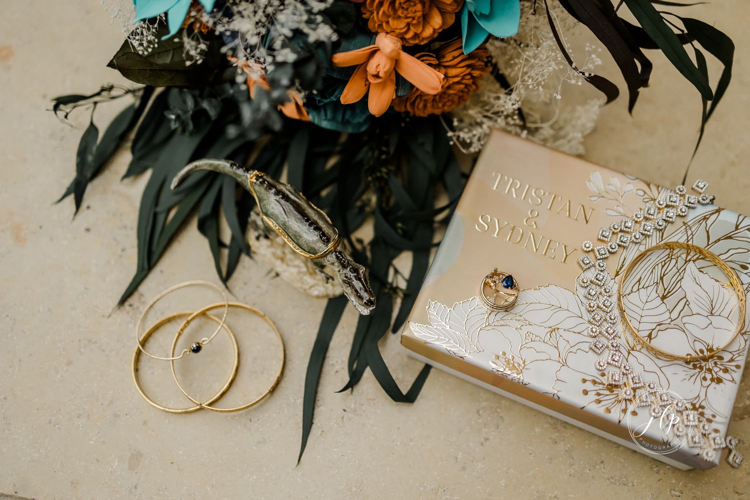 Wedding invitation suite with floral details and decorative elements.