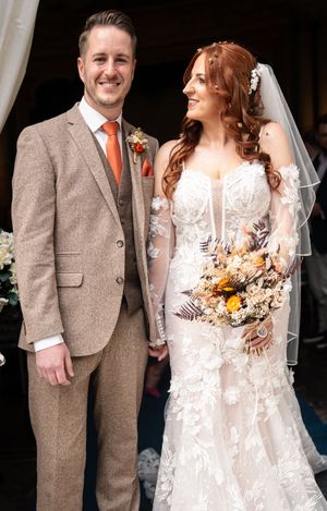 Bride in white lace dress and groom in tweed suit share candid moments during wedding photo series.