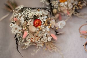 Close-up detail of delicate dried flower and baby's breath wedding decorations.