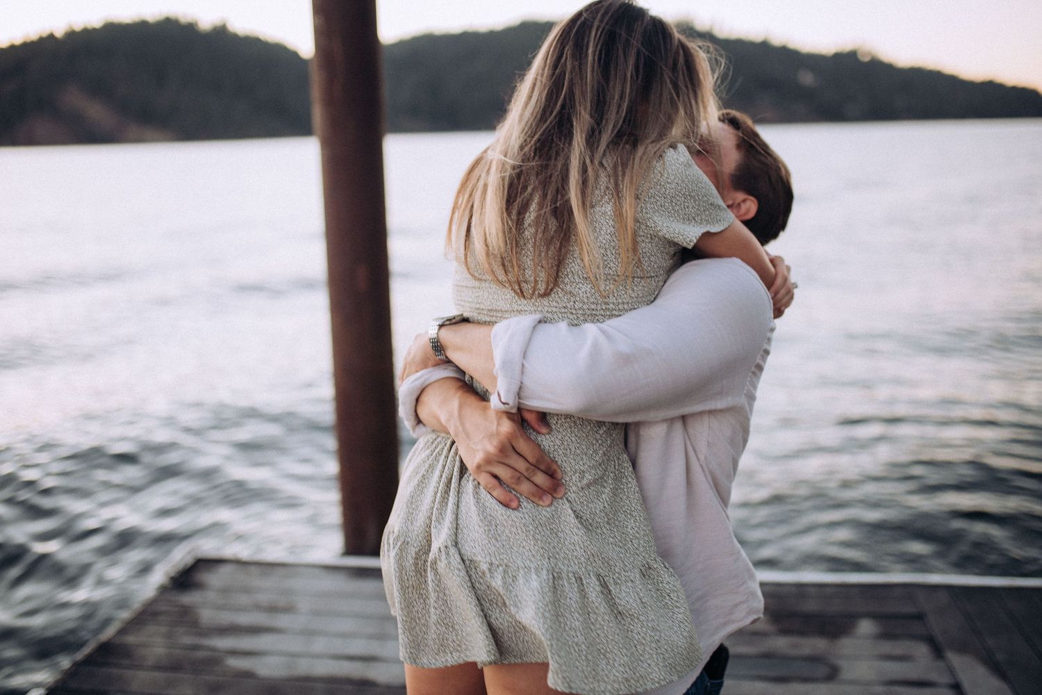 Engaged couple during a romantic engagement session on Coeur d’Alene Lake in North Idaho