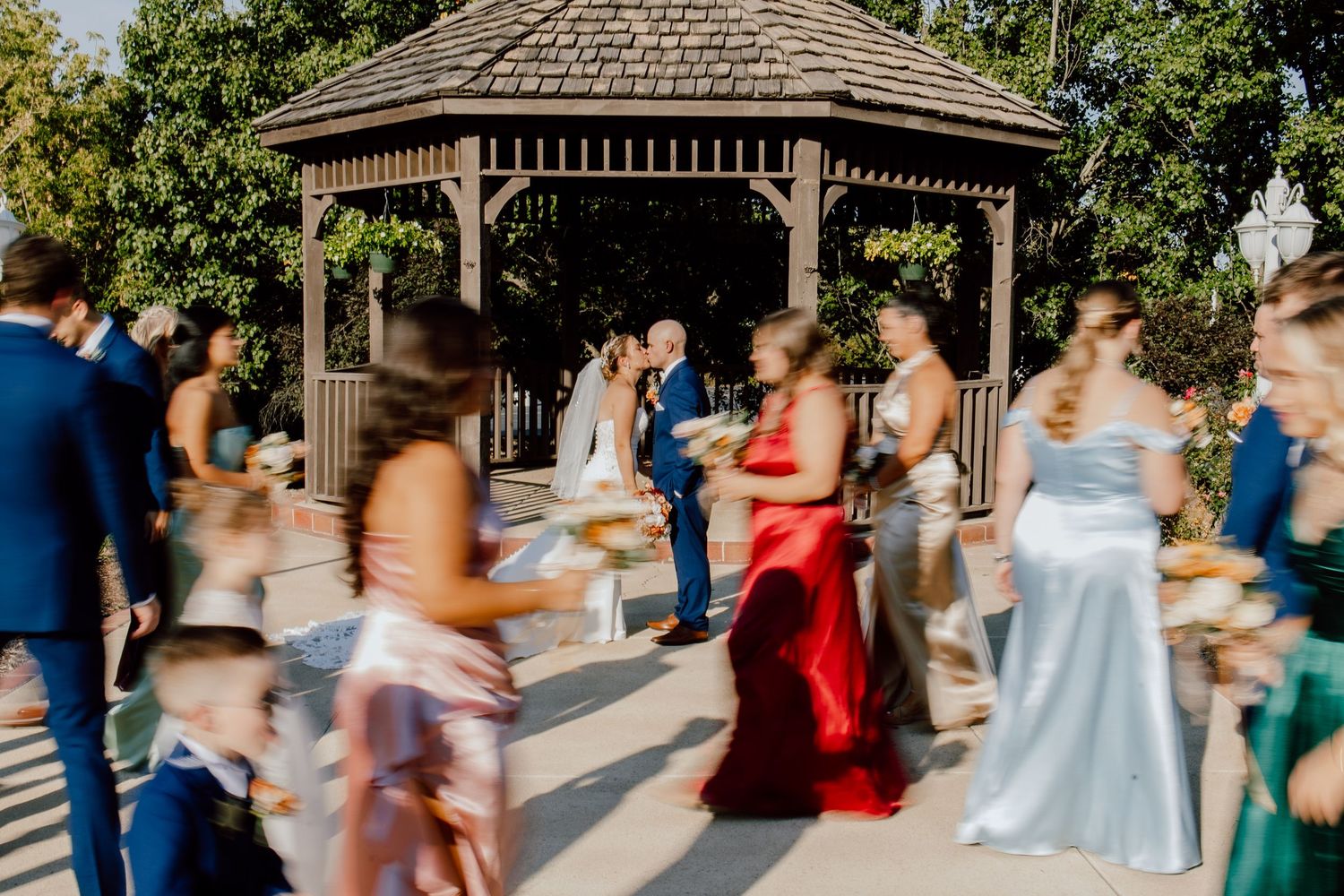A couple shares a joyful moment walking together outdoors during their wedding photoshoot.