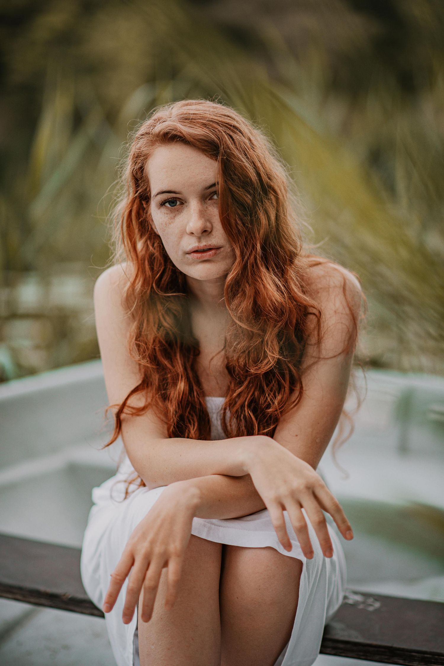 Artistic portrait series showing a woman in white against a soft blurred background.