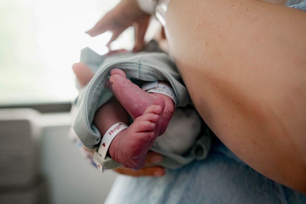 Close-up details of newborn care and tender moments.