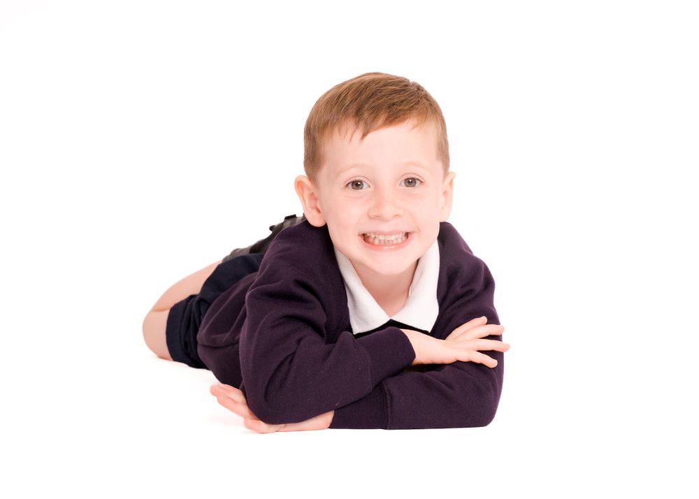 School portrait photography featuring student poses against white background.