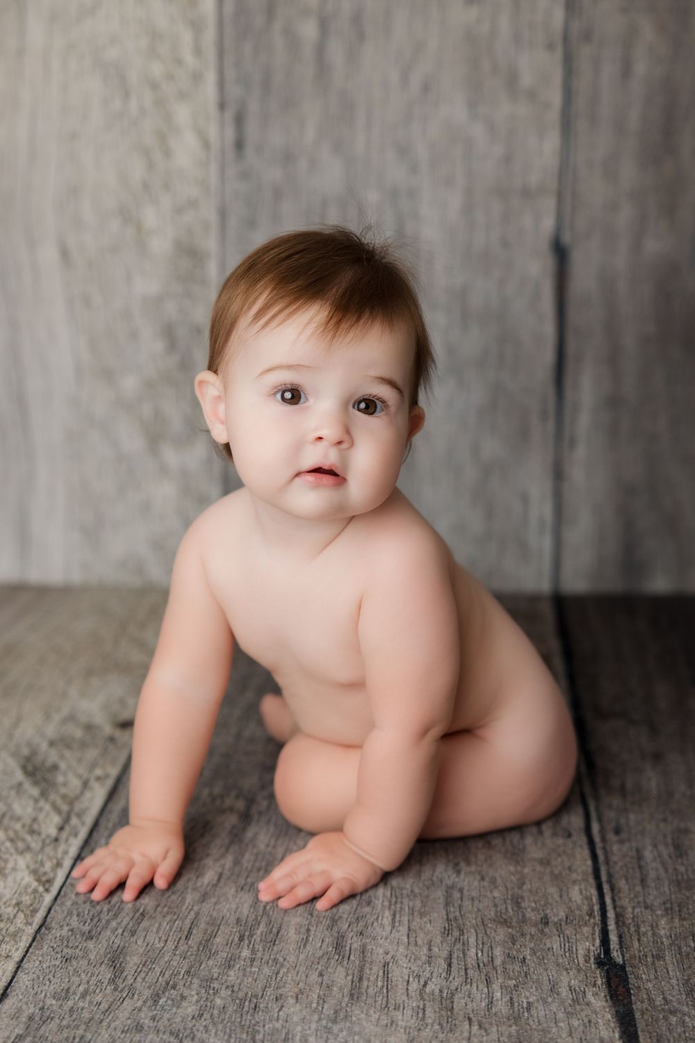 A crawling baby on a rustic wooden floor captured in a sweet, sequential progression photo collage.