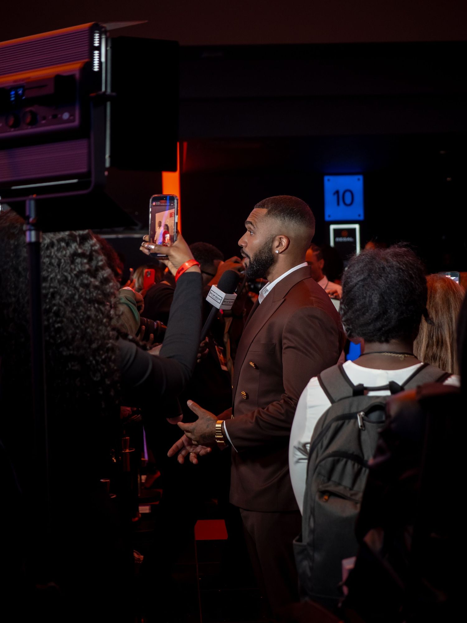 Dark venue with Netflix branding hosts evening entertainment event.