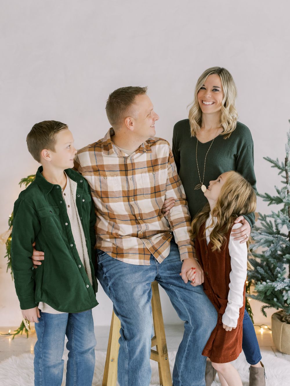 Family portrait at White Space Studios with Christmas backdrop