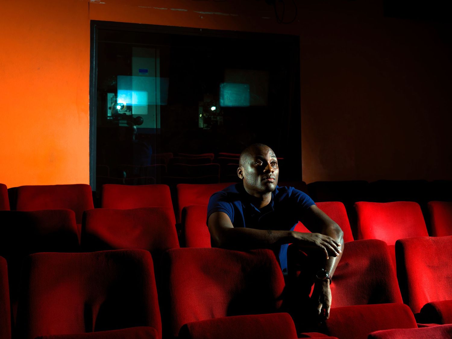 Editorial portrait of writer and curator Ekow Eshun photographed in a London screening theatre.