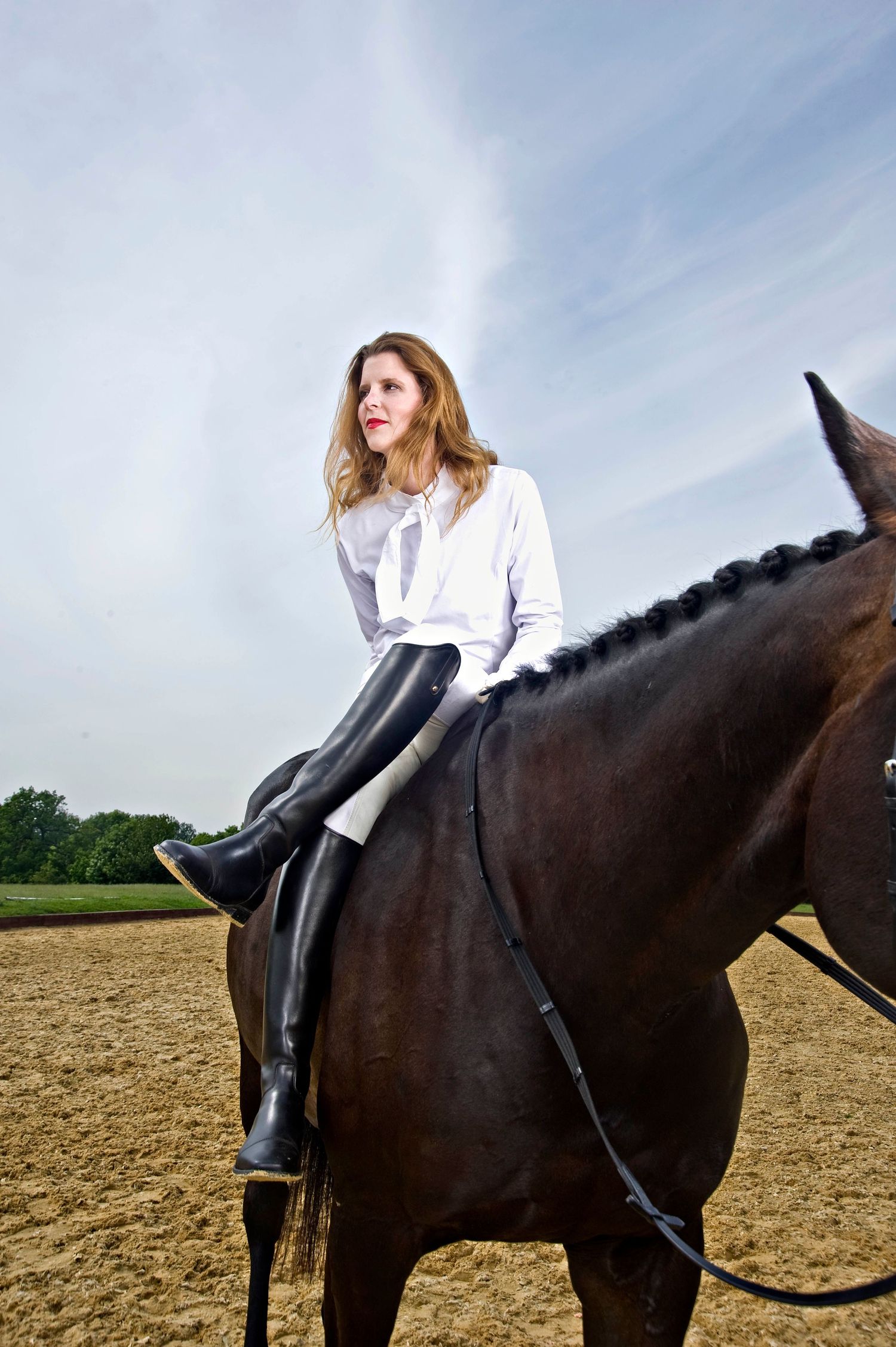 Editorial equestrian portrait of rider on horseback in the countryside, Water Farm, Suffolk