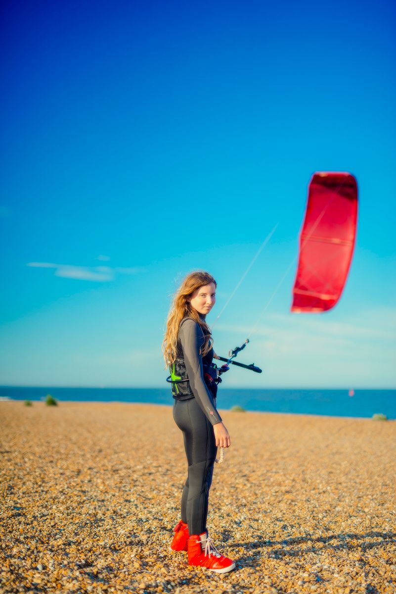 Action portrait of kitesurfer Holly Keegan on the Bawsey, Suffolk coast