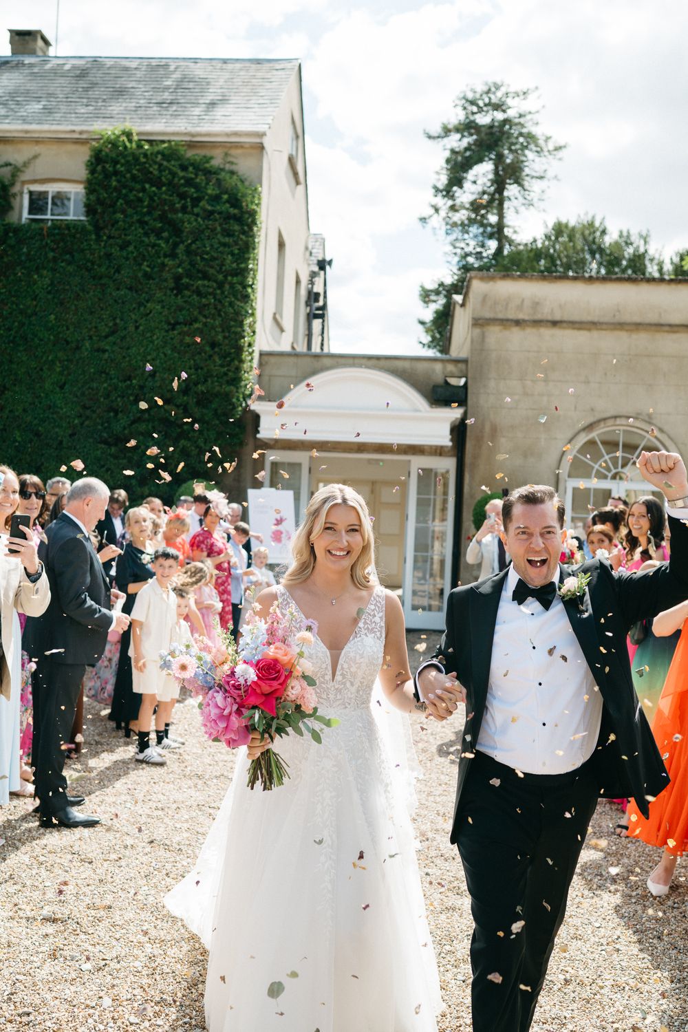 Wedding guests shower a couple with colorful confetti in sequence of celebratory outdoor photos.