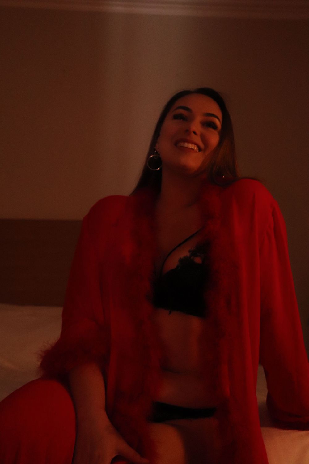 A woman posing for a boudoir photo