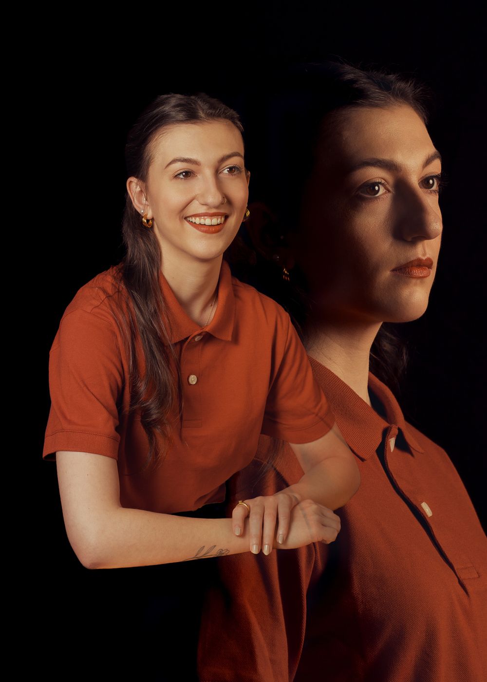 Creative dual portrait showing contrasting expressions in matching orange polo shirts.