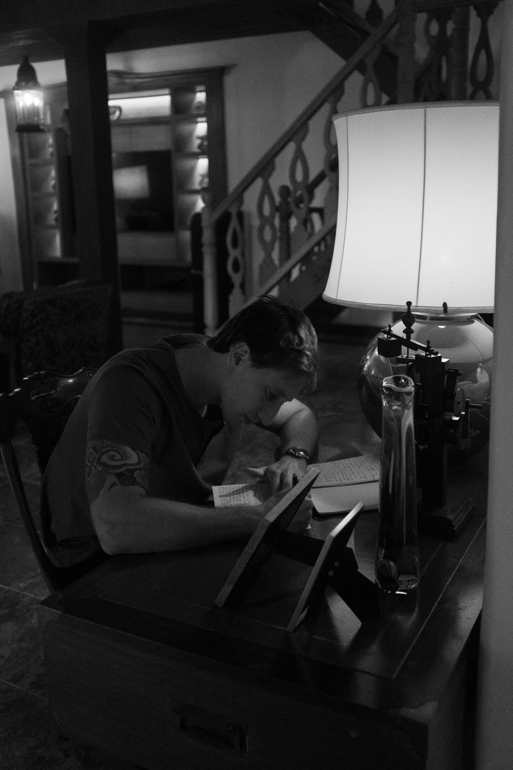 A sequence of dark moody interior shots showing a couch and lamp in low light conditions.