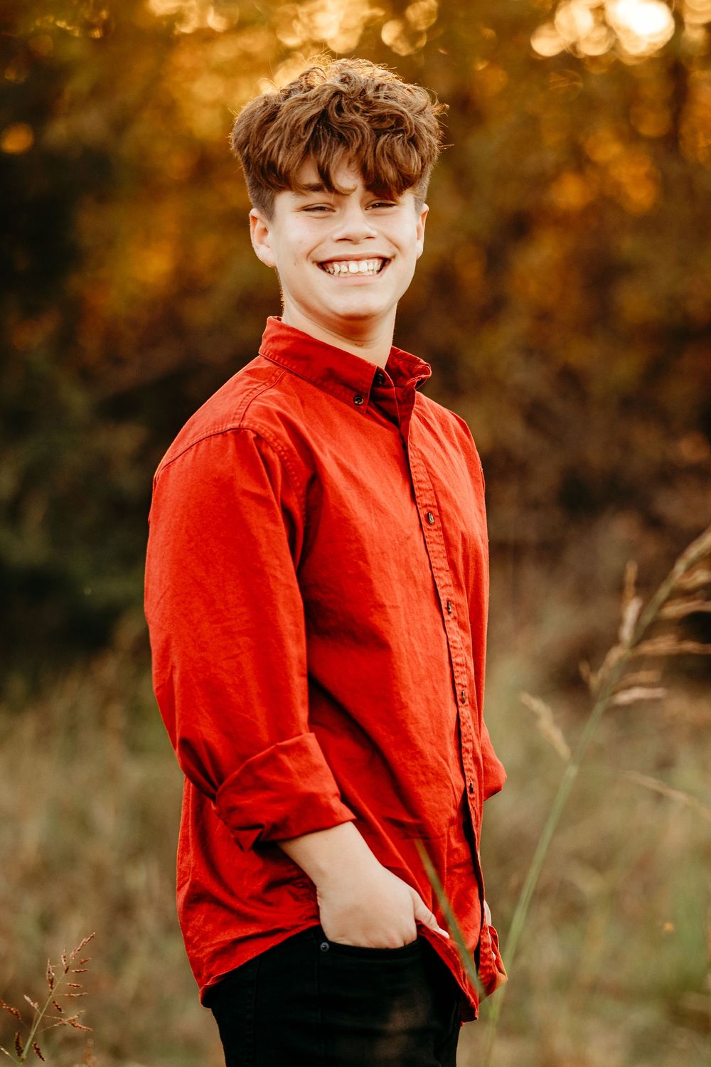 A series of photos showing someone wearing a bright red button-down shirt posing outdoors against an autumn background.